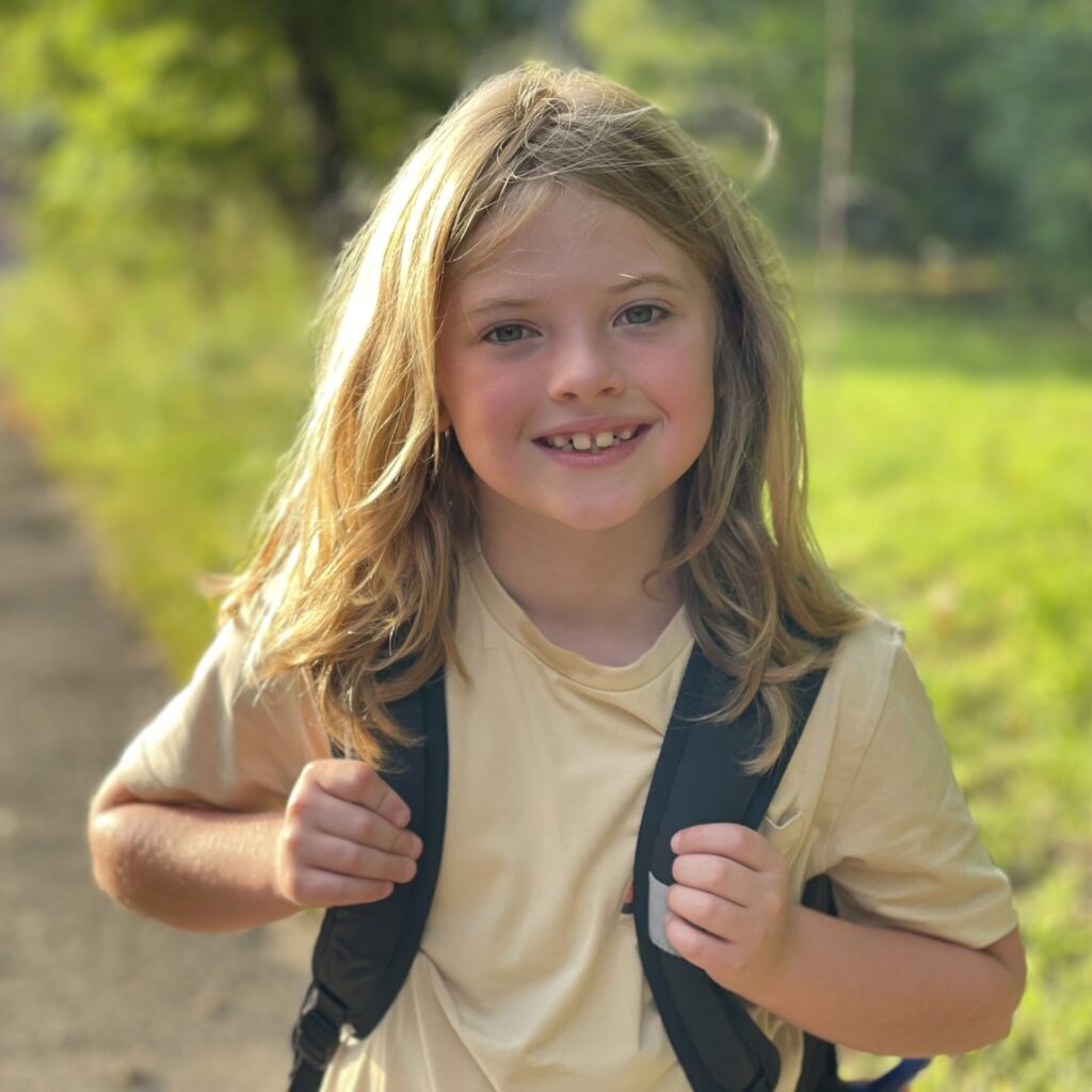 Photo of a child outside walking to school