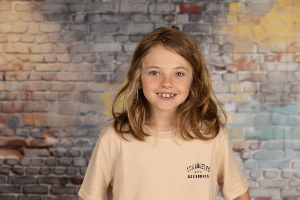 A young boy smiling.