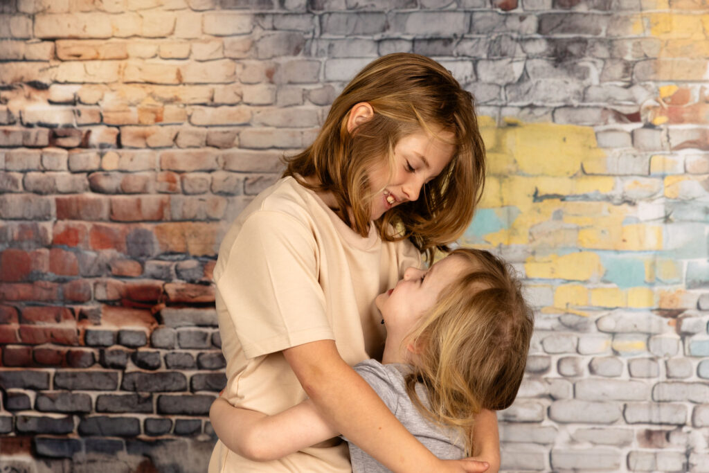 Two young brothers hugging