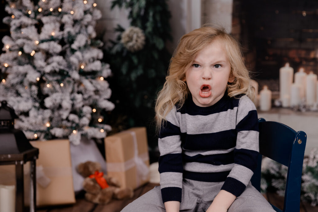 A young boy making a funny face.