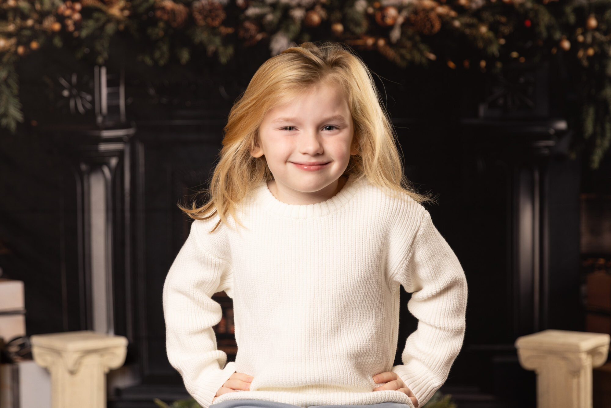 Woodlawn Studios Holiday Portraits Billerica MA 2025 youn boy smirking at camera.