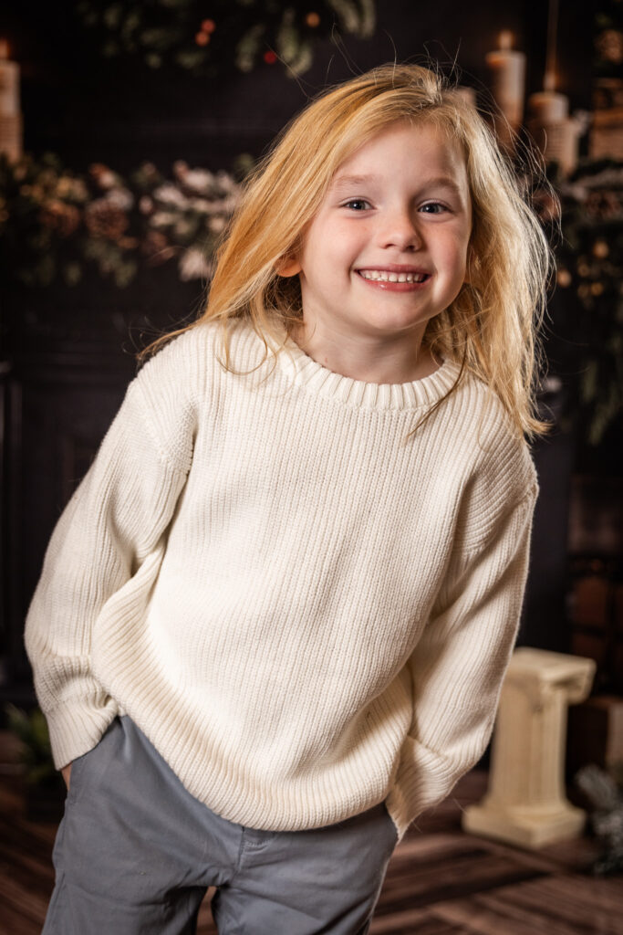 Woodlawn Studios Holiday Portraits Billerica MA 2025 young boy smiling with hands in pockets.