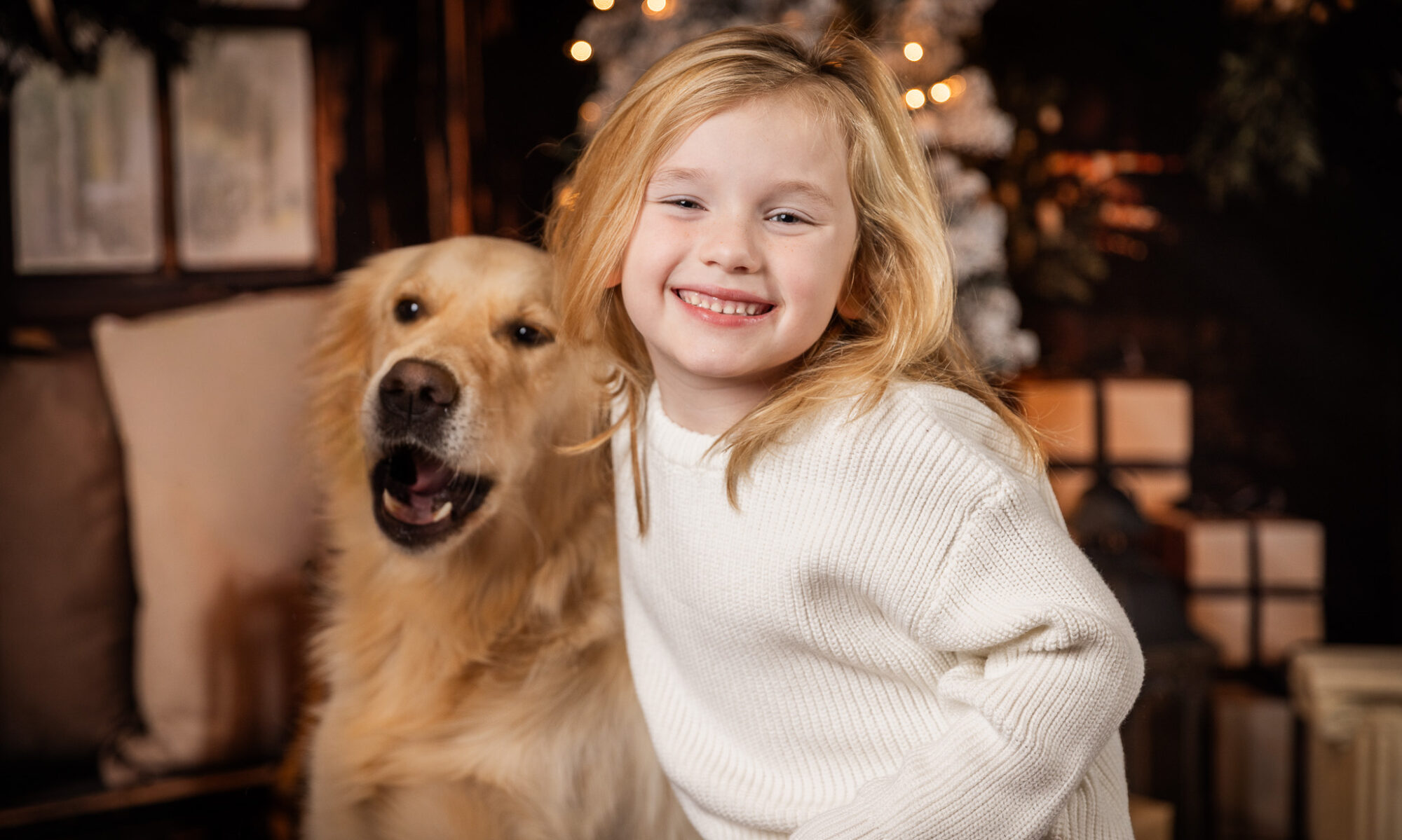 Woodlawn Studios Holiday Portraits Billerica MA 2025 young boy smiling with golden retriever dog pet.